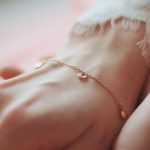 closeup-shot-female-wearing-fashionable-bracelet-with-charm-pendants_1
